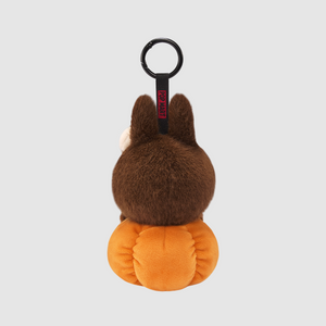 Back view of the sitting pumpkin vinyl plush pendant