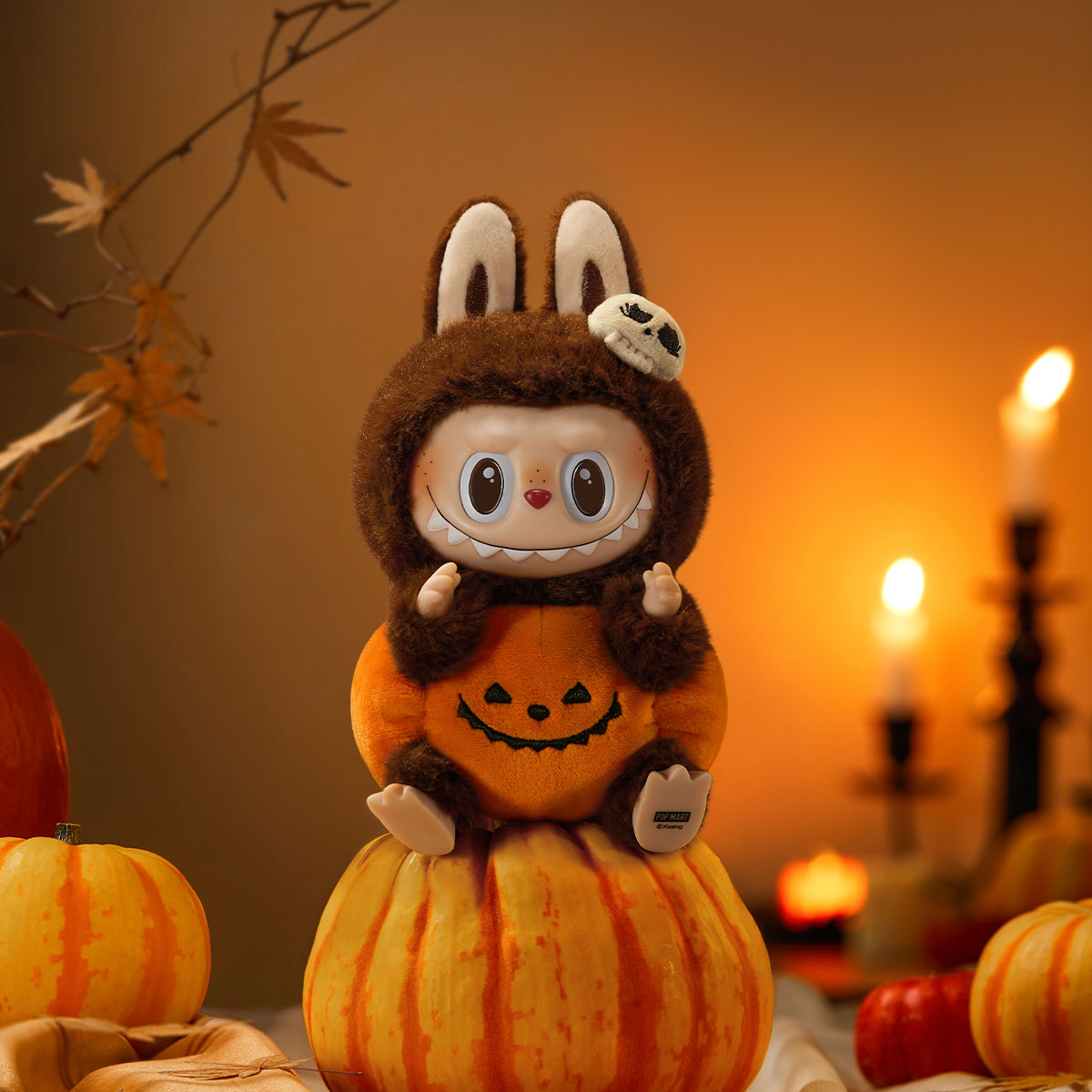 Close up of pumpkin face and vinyl detailing on Halloween plush pendant